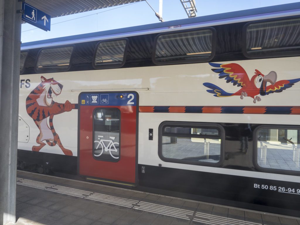 Some trains in Switzerland have a special wagon for kids, with slides and a real playground.