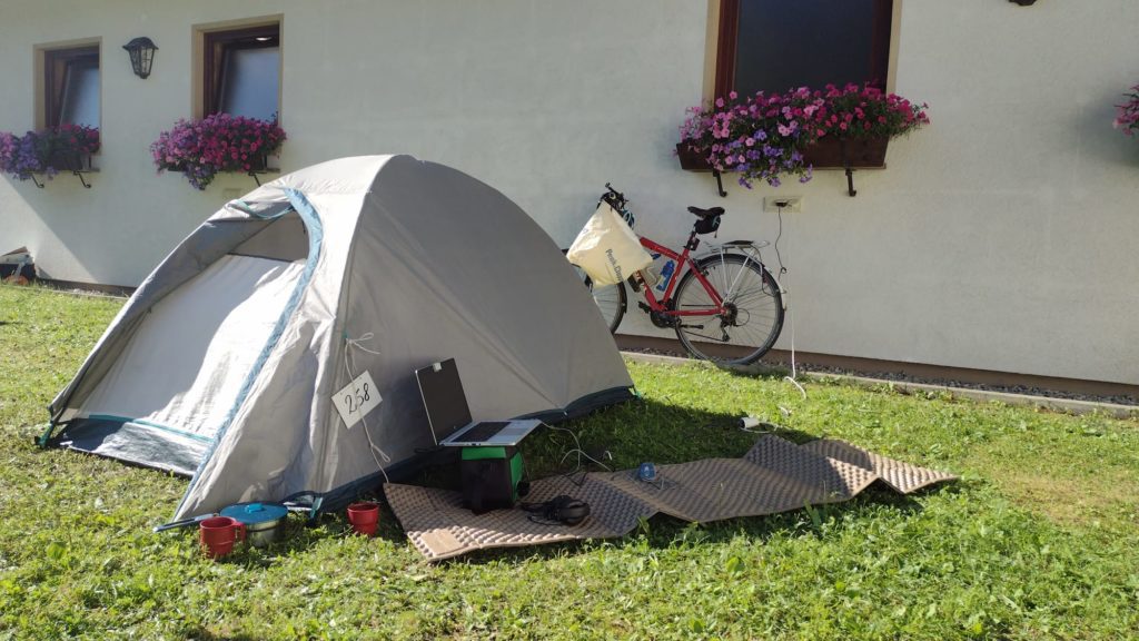 working remotely on a campsite while bicycle touring 