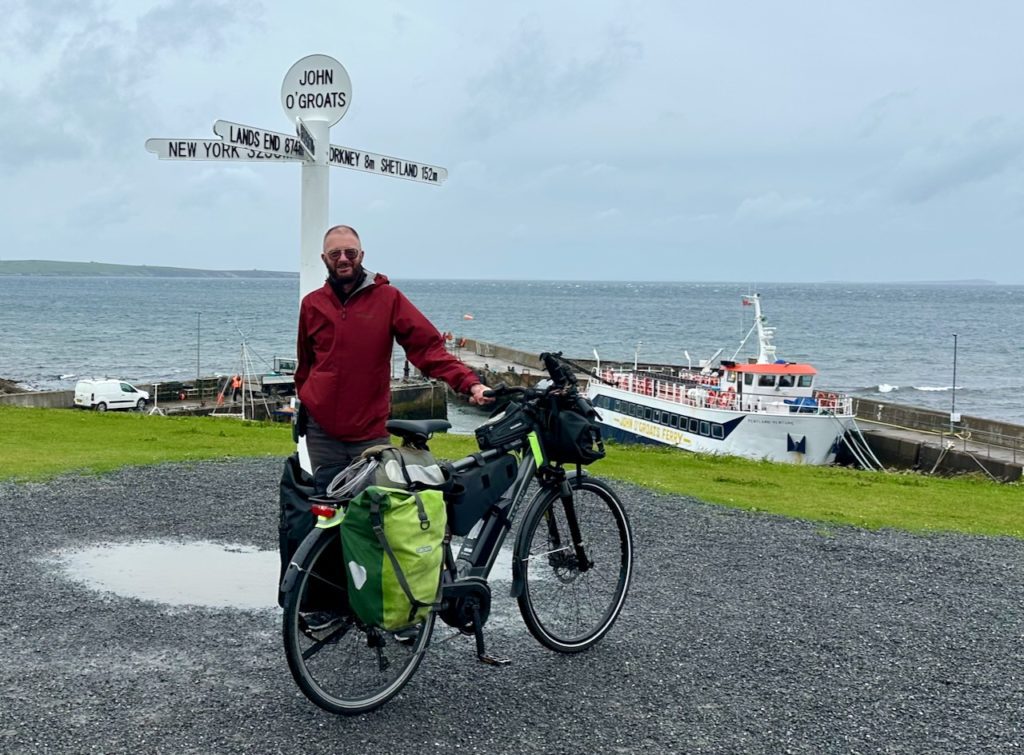 Andrew and his loaded e-bike. Photo by: Andrew Flood